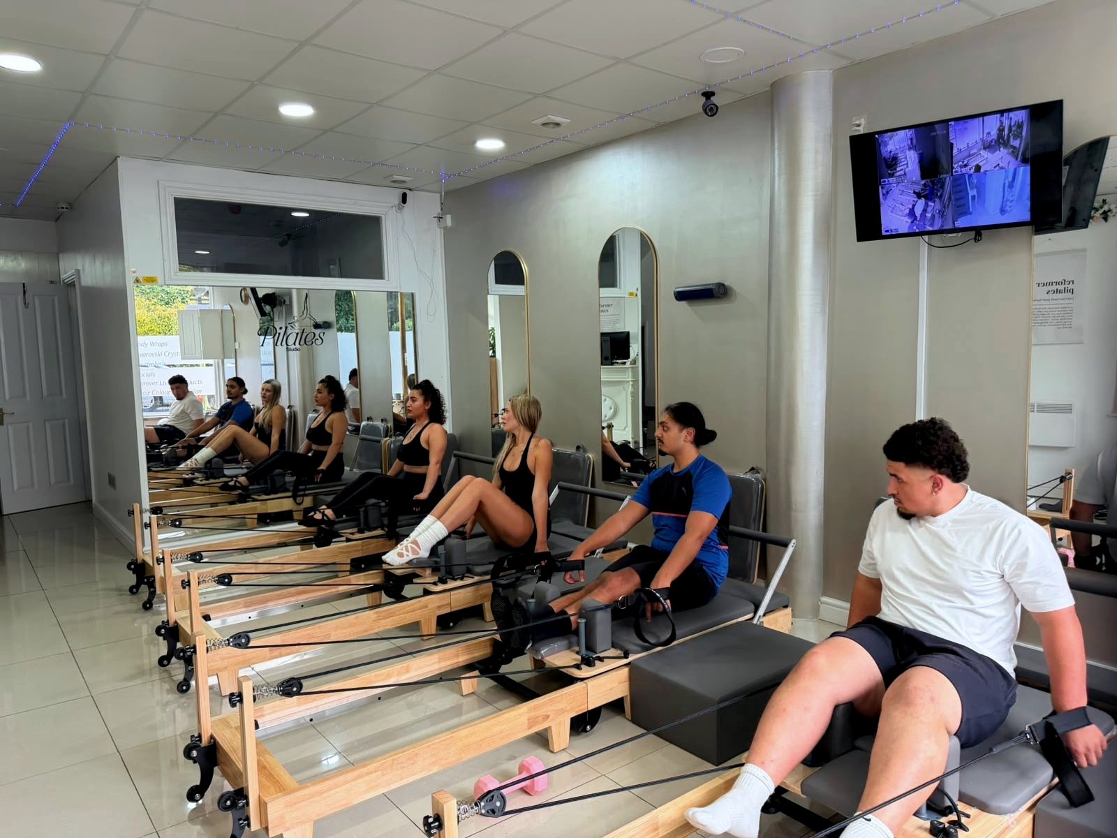 A Reformer Pilates class in session at the Bristol studio